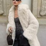 Manteau mi long en fausse fourrure blanche à revers crantés Veste longue d'hiver écologique pour femme 2026